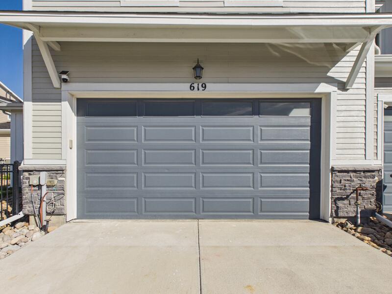 Attached 2-car garage and driveway at 619 Stonebridge Drive