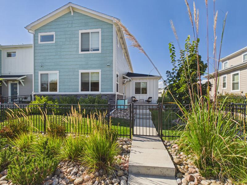 Front exterior of 619 Stonebridge Drive, a remodeled end-unit townhome in Parkes at Stonebridge, Longmont, Colorado