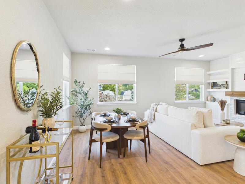 Open-concept living and dining area with new flooring in a remodeled Longmont townhome